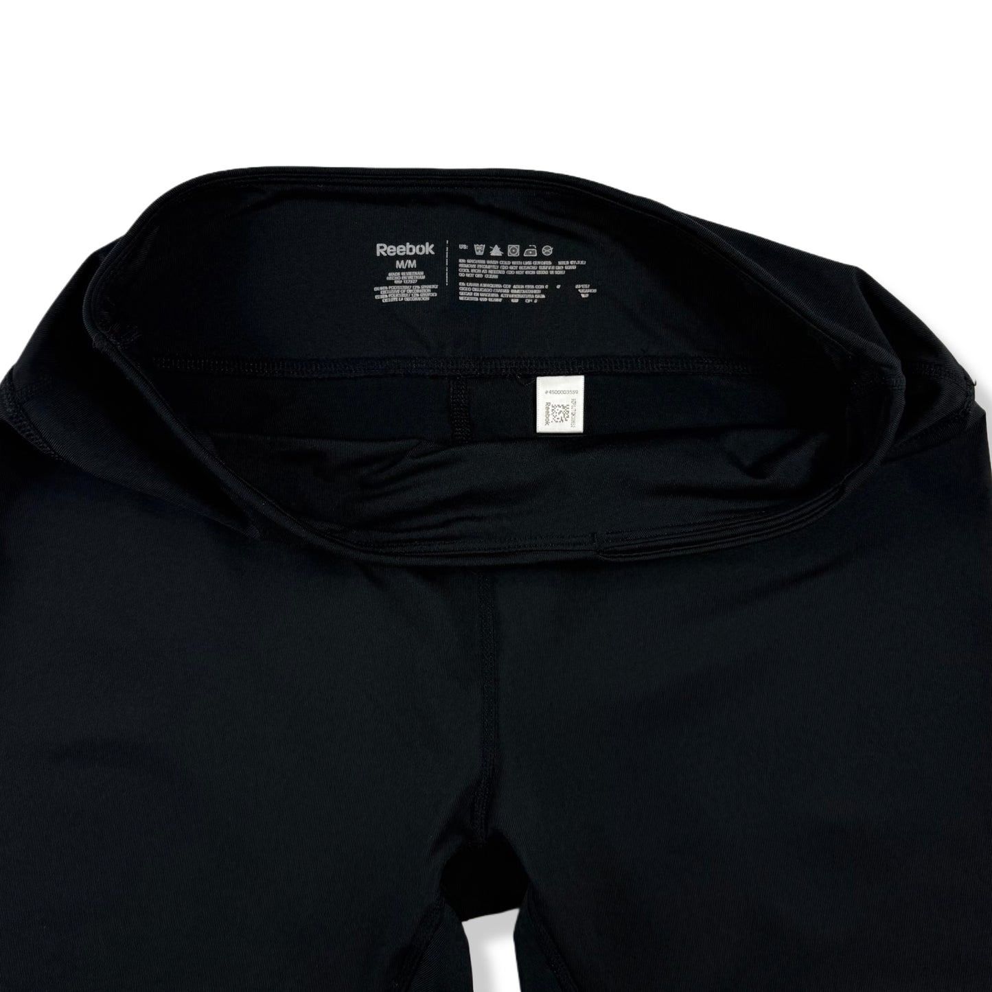 LEGGINGS DEPORTIVOS NEGROS 3/4 CON LOGO LATERAL | REEBOK | TALLA M