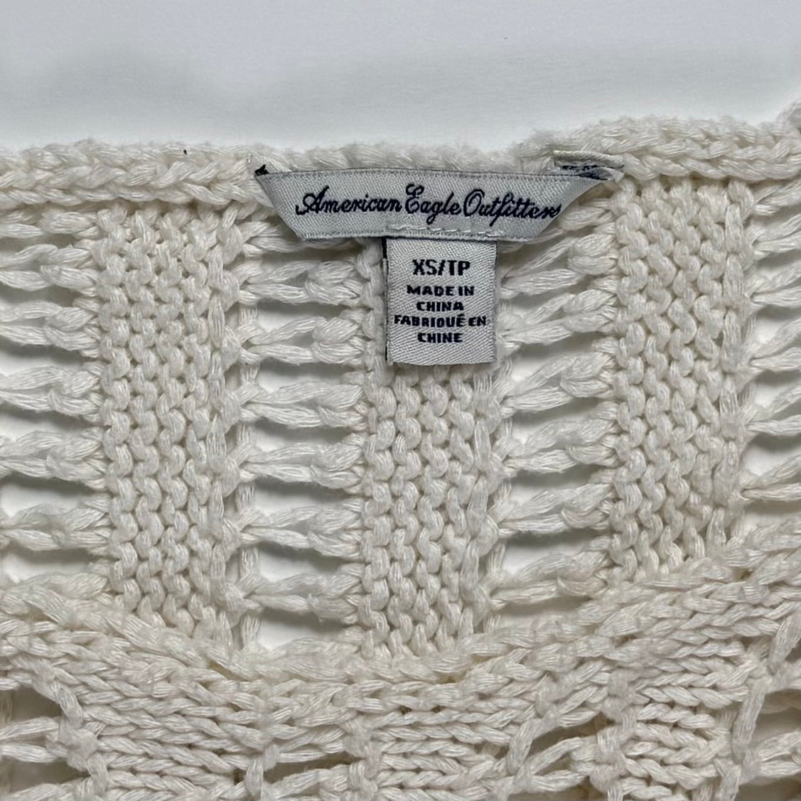 TOP TEJIDO CON FLECOS | AMERICAN EAGLE OUTFITTERS | XS