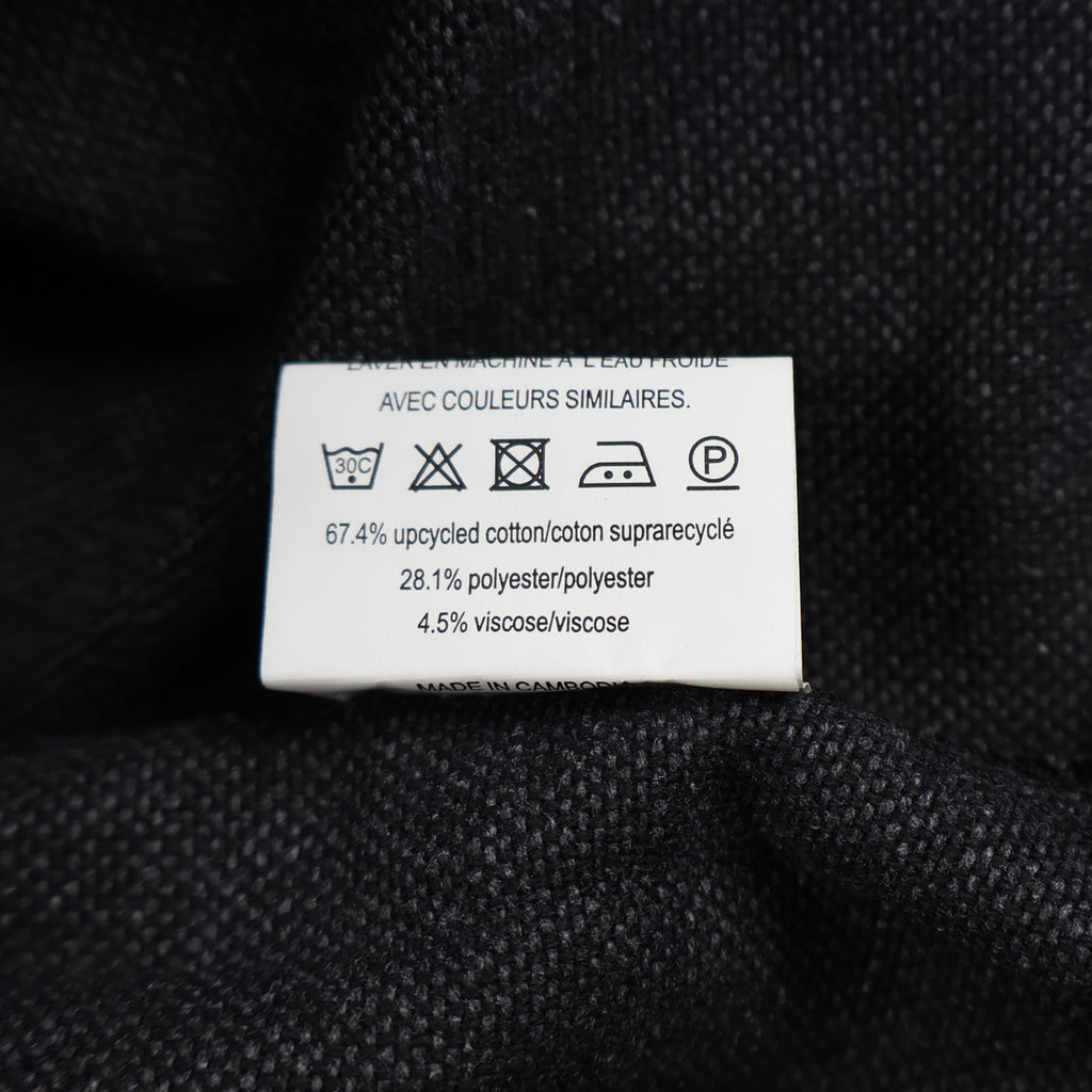 Etiqueta de composición del bolso Calvin Klein con algodón reutilizado, poliéster y viscosa.