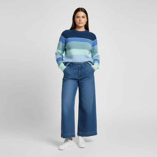 Model wearing blue striped sweater with wide-leg pants